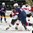 GRAND FORKS, NORTH DAKOTA - APRIL 19: USA's Ryan Lindgren #18 takes out the Switzerland forward during preliminary round action at the 2016 IIHF Ice Hockey U18 World Championship. (Photo by Minas Panagiotakis/HHOF-IIHF Images)

